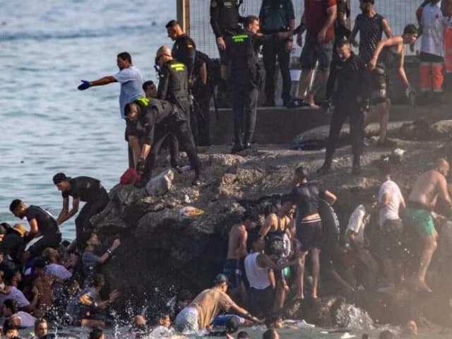 Spain urges calm after anti-migrant clashes