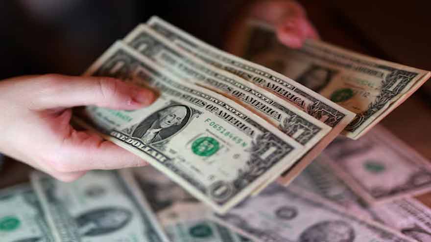 US Dollar hovers near multi-month lows as Treasury yields retreat ahead of Fed minutes