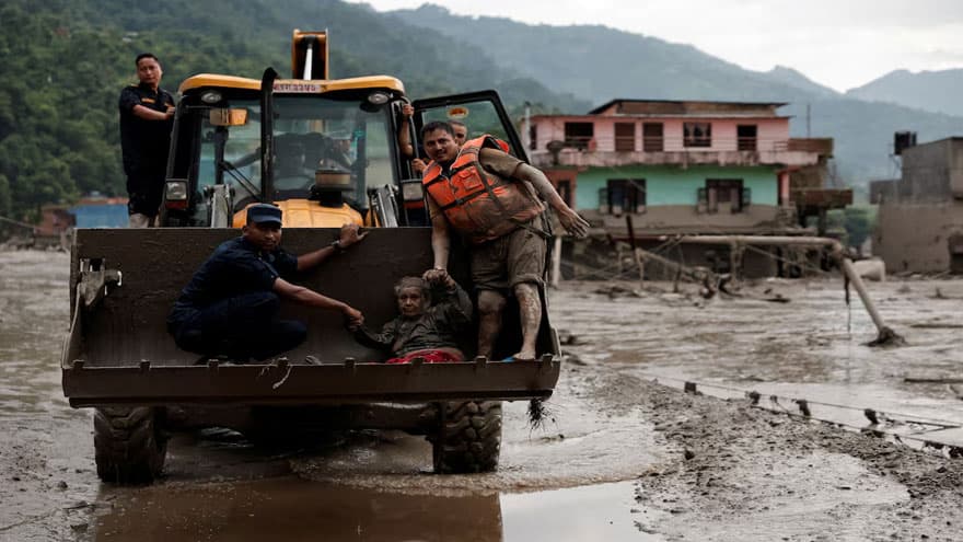 Mother reunited with 8-year-old who climbed trees to survive Nepal floods